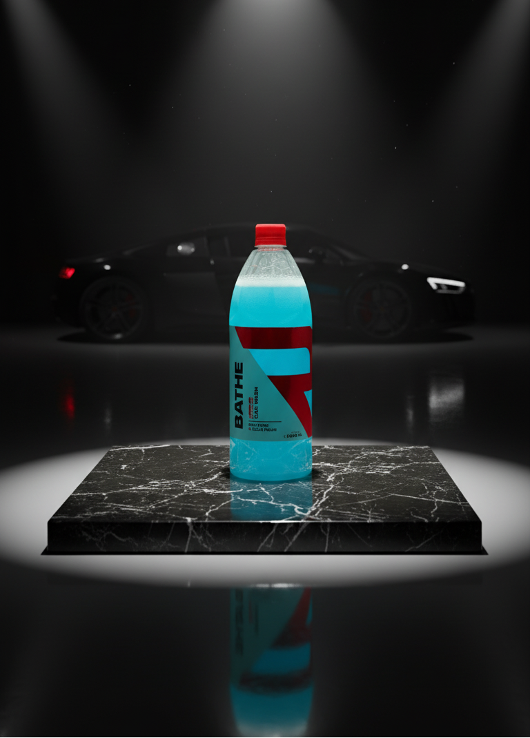 Blue bottle with red cap on a black marble surface with car in the background